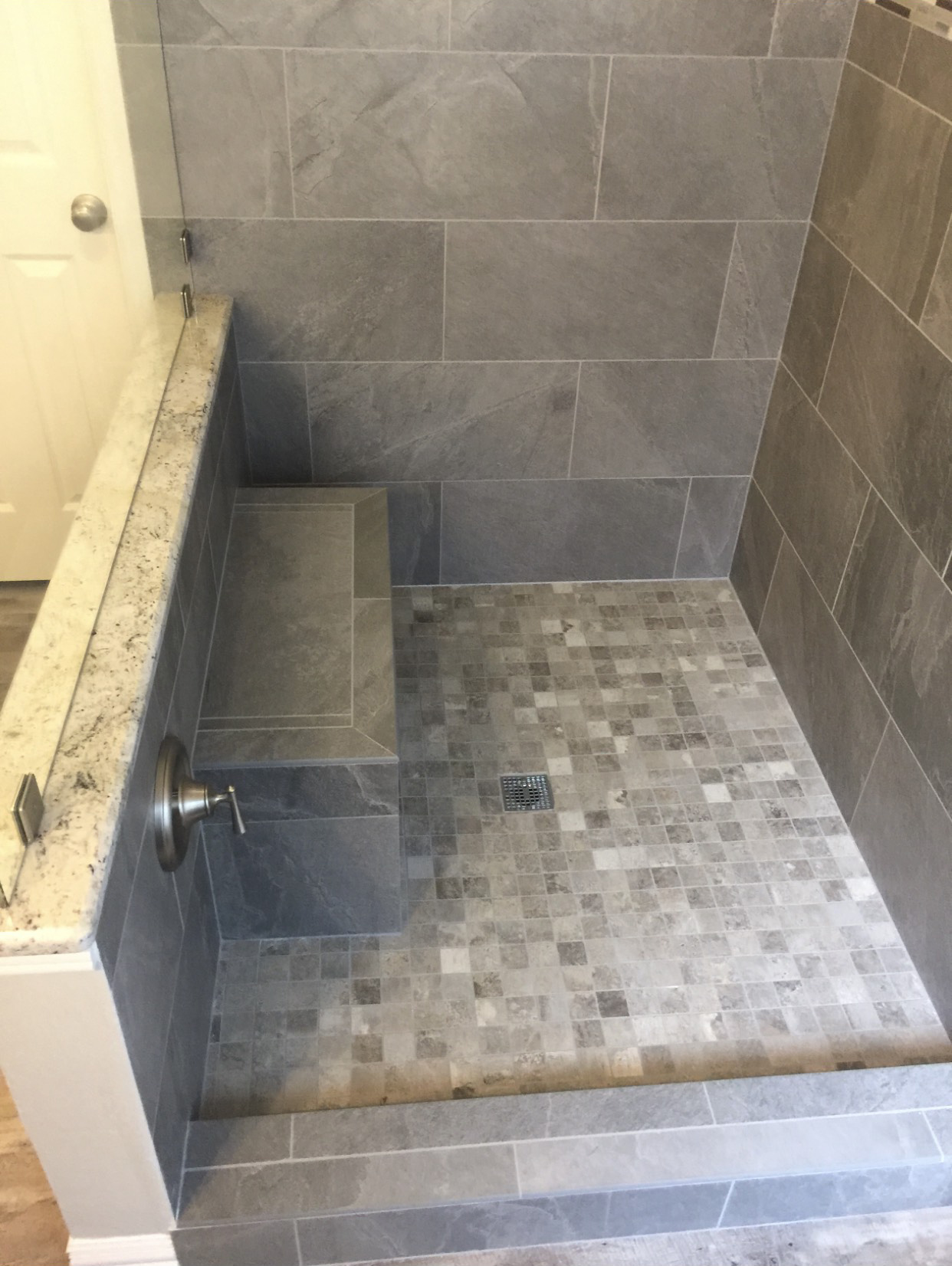 bathroom remodel with gray tile